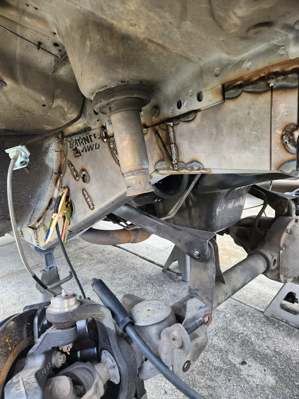 Ford Bronco frame and suspension mounts after weld repair, before paint
