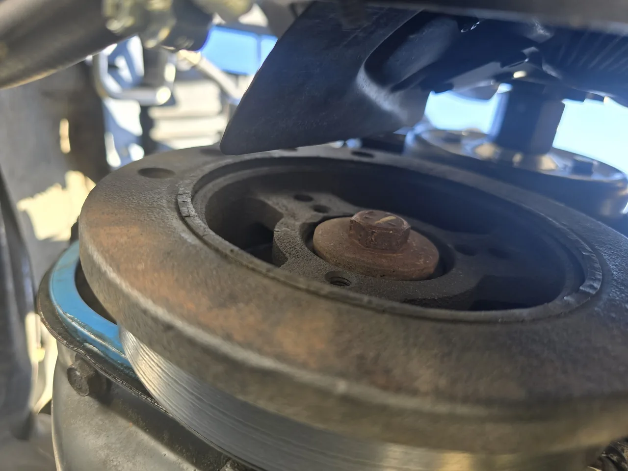 Crankshaft pulley exposed during an accessory belt job