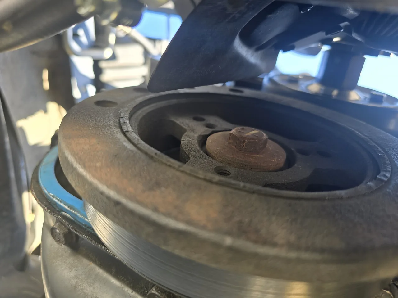 Close-up of a crankshaft pulley and center bolt