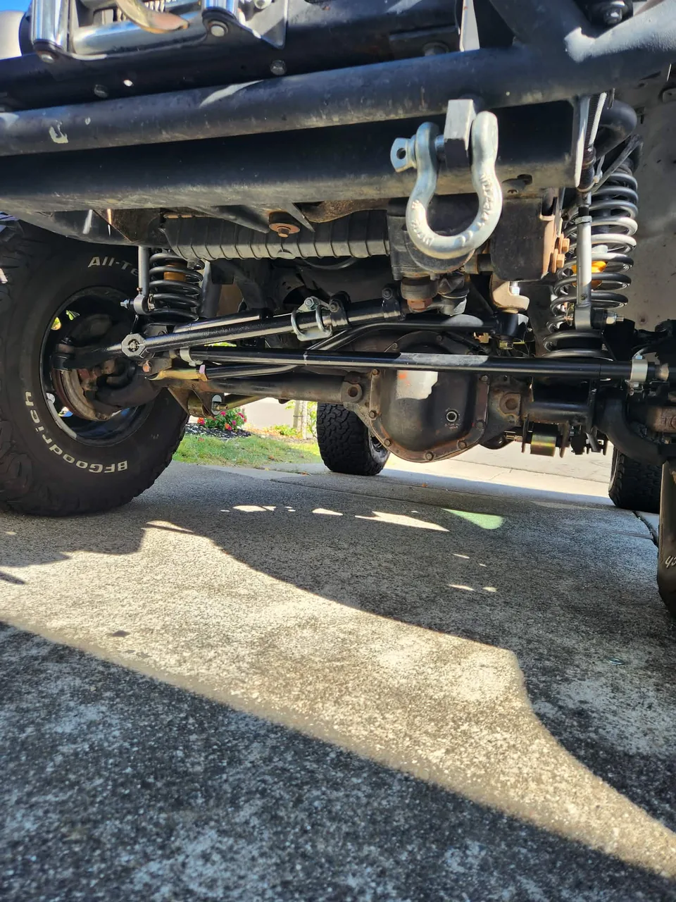 Undercarriage of a lifted Jeep showing new suspension components