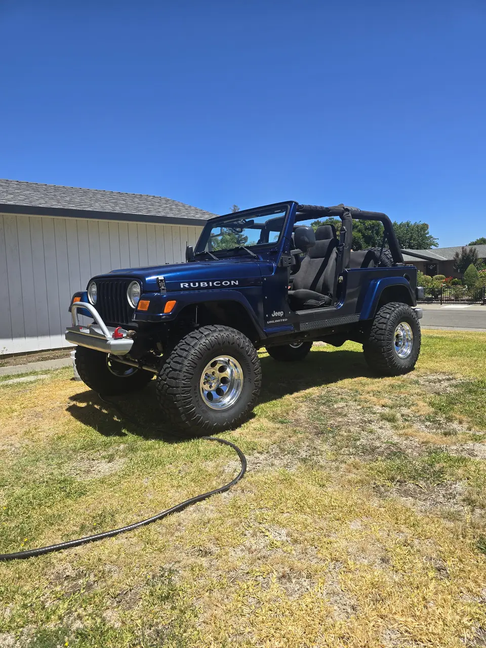 Lifted blue Jeep Wrangler Rubicon after suspension and gear work