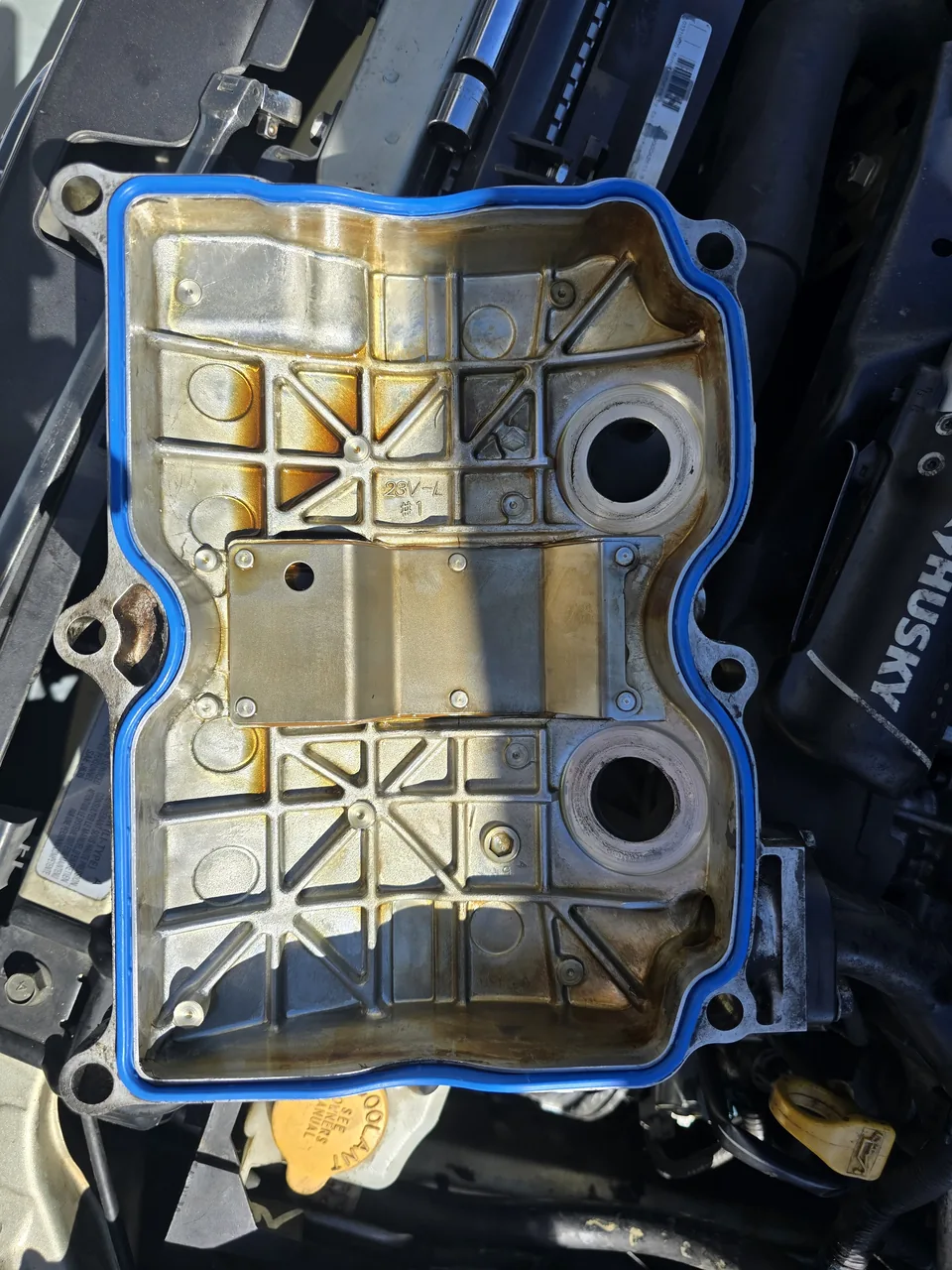 Valve cover with a new gasket ready to install